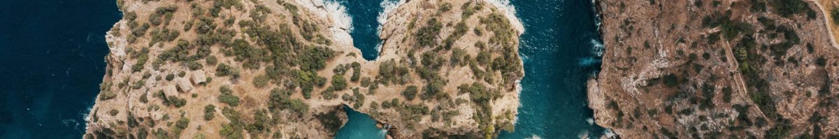 Birds Eye view of a shore break Beach and waves top view. Turquoise water background aerial view. Summer seascape from air. Top view from drone. Travel concept idea