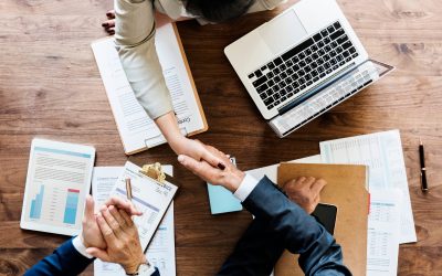 Business people shaking hands together