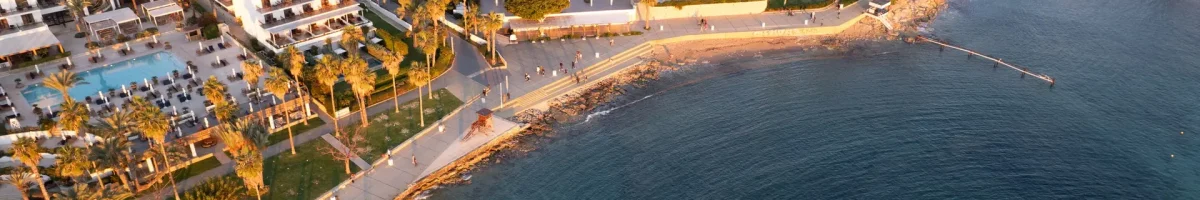 Drone aerial view of Paphos coastal city at sunset. Cyprus holiday resort cities. Drone aerial view of Paphos coastal city at sunset. Cyprus holiday resort cities.